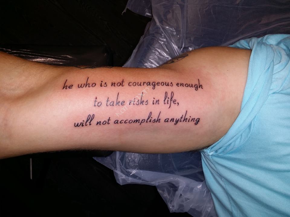 courageous life inner arm quote tattoo